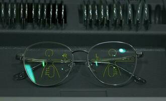 Close-up of glasses, eyeglass progressive lenses photo