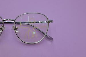 Close-up of glasses, eyeglass progressive lenses photo