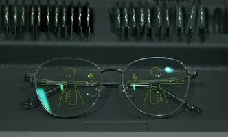 Close-up of glasses, eyeglass progressive lenses photo