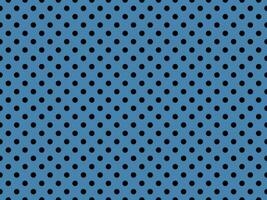 black polka dots over steel blue background photo