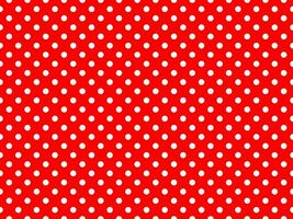 white polka dots over red background photo