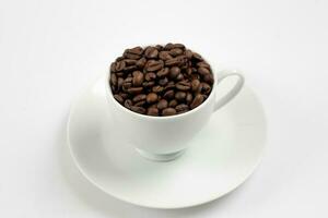 Coffee beans in white glass, white background photo