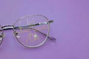 Close-up of glasses, eyeglass progressive lenses photo