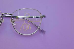 Close-up of glasses, eyeglass progressive lenses photo