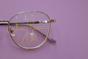 Close-up of glasses, eyeglass progressive lenses photo