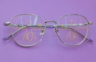 Close-up of glasses, eyeglass progressive lenses photo