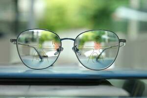 Close-up of glasses, eyeglass progressive lenses photo