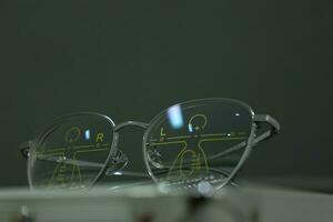 Close-up of glasses, eyeglass progressive lenses photo