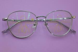 Close-up of glasses, eyeglass progressive lenses photo