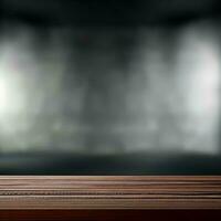 empty wooden table with smoke float up on dark background photo