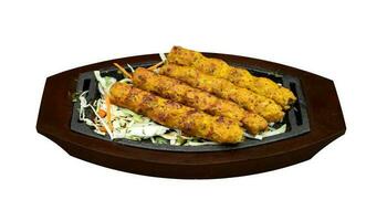 Chicken Kabab, BBQ on a wooden hot plate photo