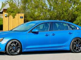 photo blue sport sedan parked in the yard