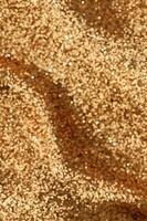 Defosused blurred glitter golden backgound vertical photo