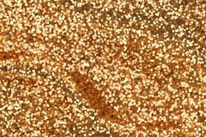 Defosused blurred glitter golden backgound photo