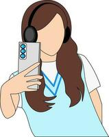 A long brown hair girl wearing a blue vest and headphones takes a selfie with smartphone while listening to music. vector