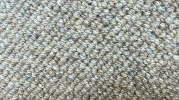 Carpet material texture background . Beige color. photo