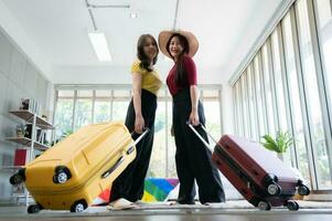 The LGBT couple enters a bedroom overlooking the natural beauty of a homestay in the countryside, a natural attraction. photo