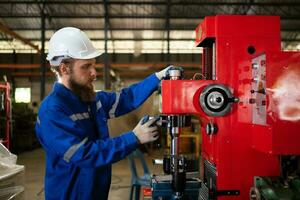 Mechanical engineers are checking the working condition of the new machine after completing the installation photo