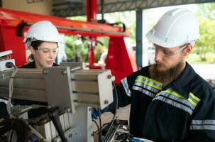 Electrical engineer with the mission of installing a robot arm electrical system photo