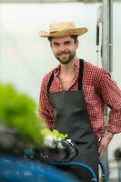 Small business owners on a mission to repair and install their own organic vegetable garden's water infrastructure. photo