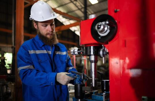 Mechanical engineers are checking the working condition of the new machine after completing the installation photo