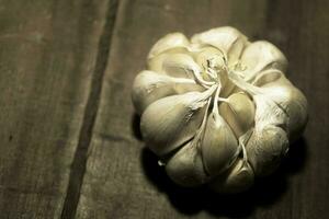 garlic on a wooden table photo