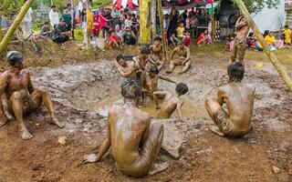 Tasikmalaya, West Java, Indonesia -17 august 2021- Banana climbing, one of the competitions held every August 17 to commemorate Indonesia's independence day photo