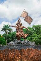 Tasikmalaya, Indonesia, November 20, 2022, Mak Eroh and Abdul Rozak Monument in Tasikmalaya City Park, the monument was erected as a form of appreciation and their struggle as farmers photo