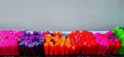 Colorful group of pen on shelf for sale with above copy space at stationery. photo