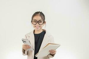 Little business lady Asia. formalwear holding a notebook standing on a white background photo