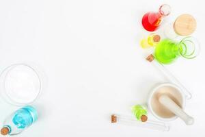 Top view science lab chemistry flask with beakers, flasks, and test tubes filled with colorful liquids photo