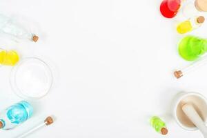 Top view science lab chemistry flask with beakers, flasks, and test tubes filled with colorful liquids photo