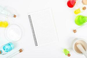 Top view science lab chemistry flask with beakers, flasks, and test tubes filled with colorful liquids photo