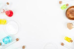 Top view science lab chemistry flask with beakers, flasks, and test tubes filled with colorful liquids photo