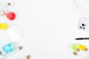 Top view science lab chemistry flask with beakers, flasks, and test tubes filled with colorful liquids photo