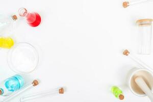 Top view science lab chemistry flask with beakers, flasks, and test tubes filled with colorful liquids photo