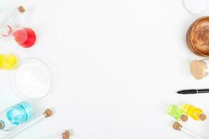 Top view science lab chemistry flask with beakers, flasks, and test tubes filled with colorful liquids photo