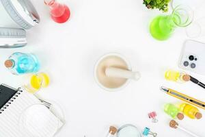 Top view science lab chemistry flask with beakers, flasks, and test tubes filled with colorful liquids photo