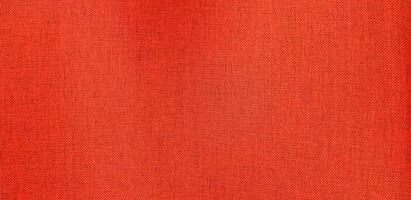 Red leather cotton or fabric chair for background. Close up surface of material and Textured wallpaper. photo