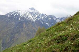 Snow-covered mountain peaks of the Main Caucasian Range. Landscape in the mountains of Georgia. photo