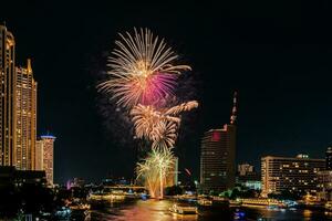 fireworks on the river in the dark sky photo