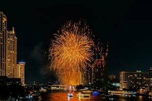 fireworks on the river in the dark sky photo