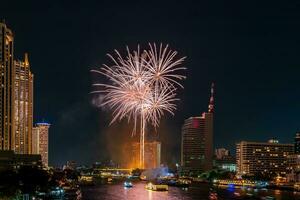 fireworks on the river in the dark sky photo