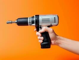 Hand-holding power drill photo