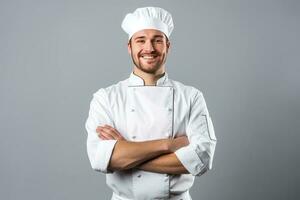 contento joven cocinero posando en uniforme foto