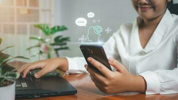 Businesswoman hand uses a smartphone to type live chat, ask, answer with an artificial intelligence system. chat bot. Ai. photo