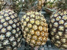 Fruit stand with delicious pineapple arrangement photo