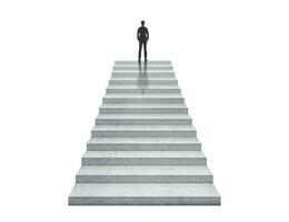 Vision concept. Successful businessman standing on staircase photo