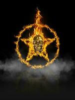 Fire skull and ring star, of fire in black smoke background photo