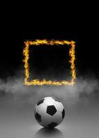 Soccer ball and ring of fire in black smoke background photo